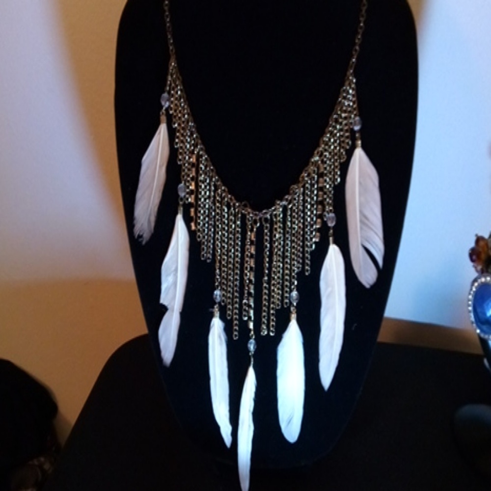 Cream Feather in chain necklace.